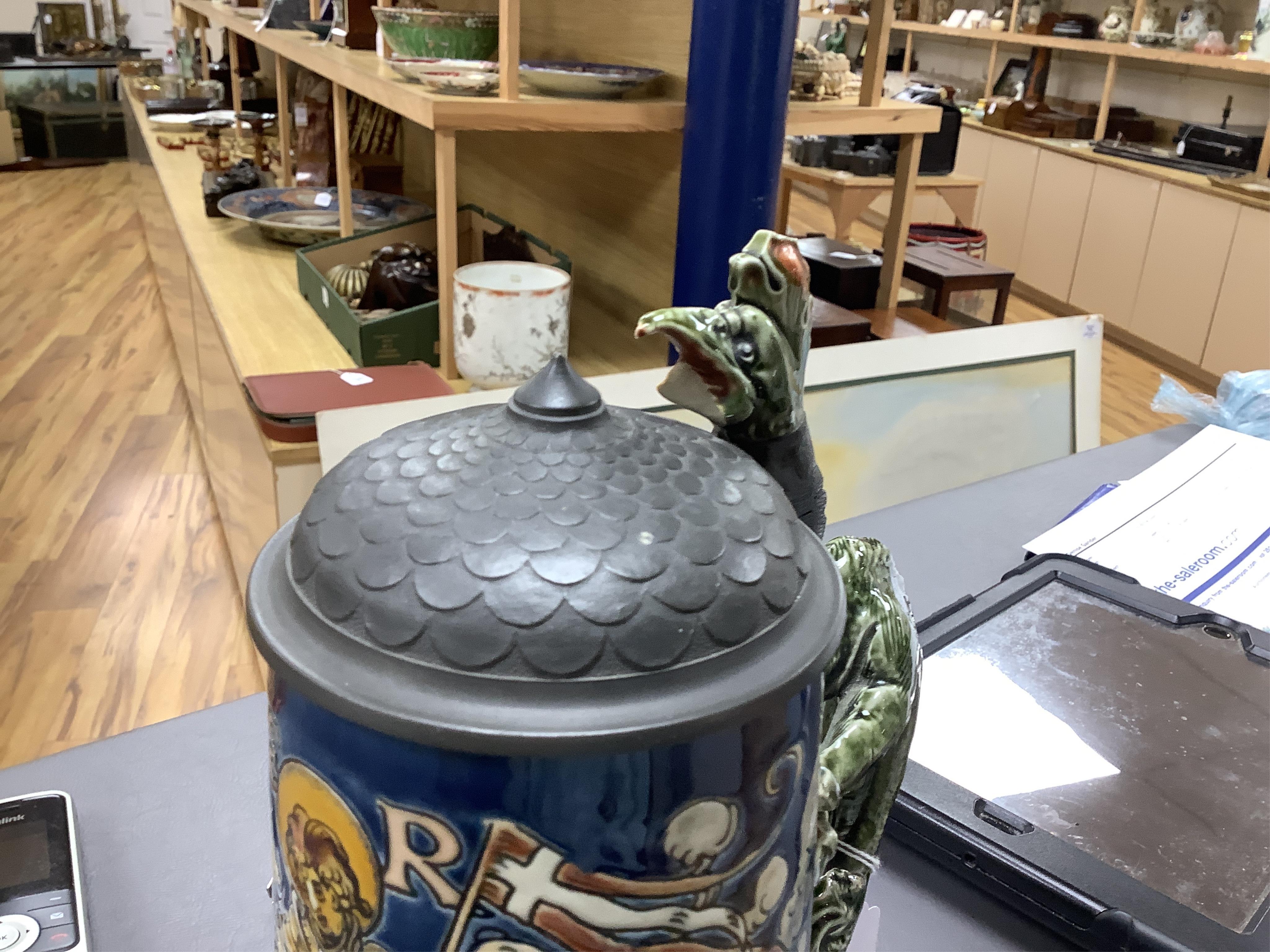 A Mettlach ‘ St Florian‘ stoneware stein, 27cm